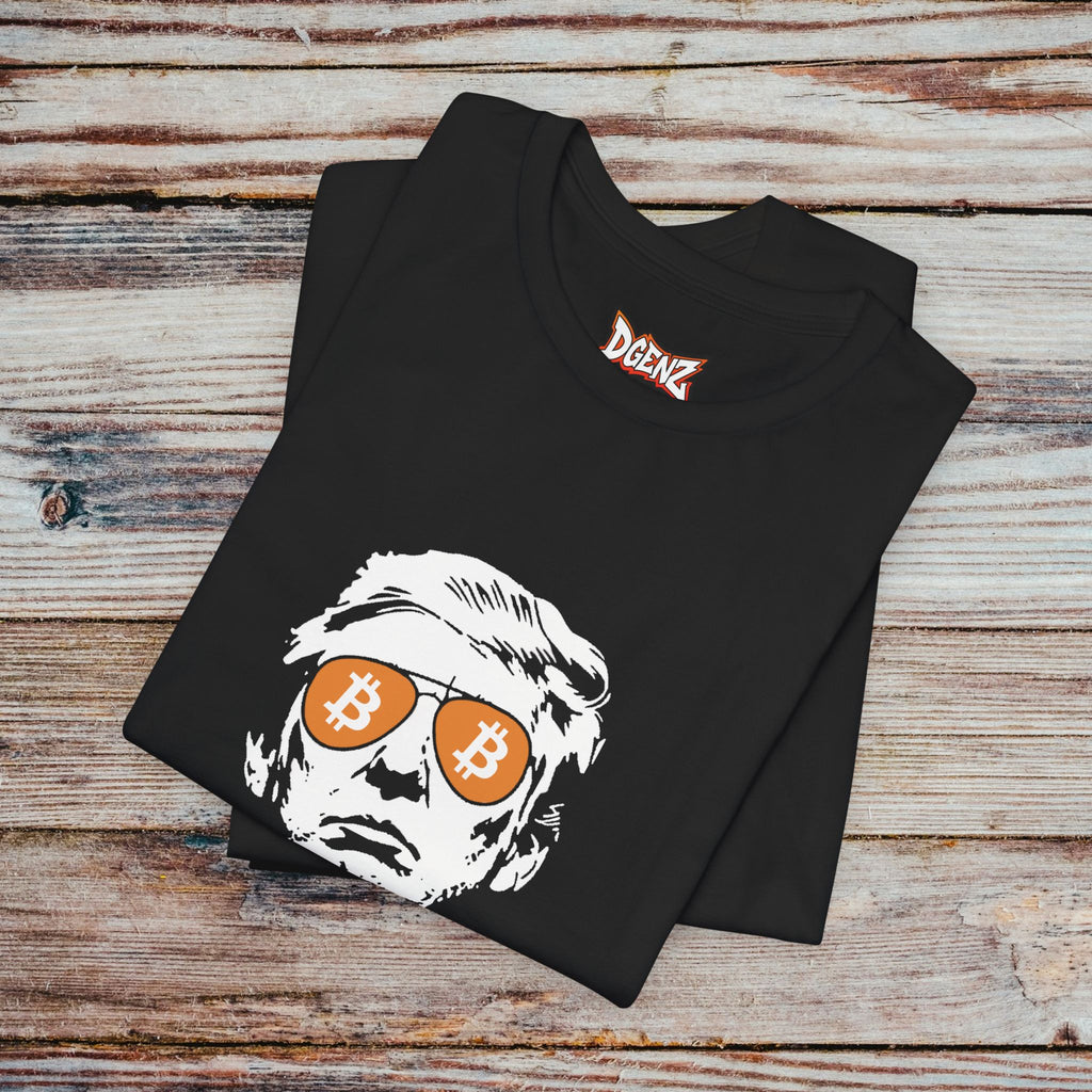 Folded black Bitcoin Trump T-Shirt featuring BTC sunglasses and political streetwear design