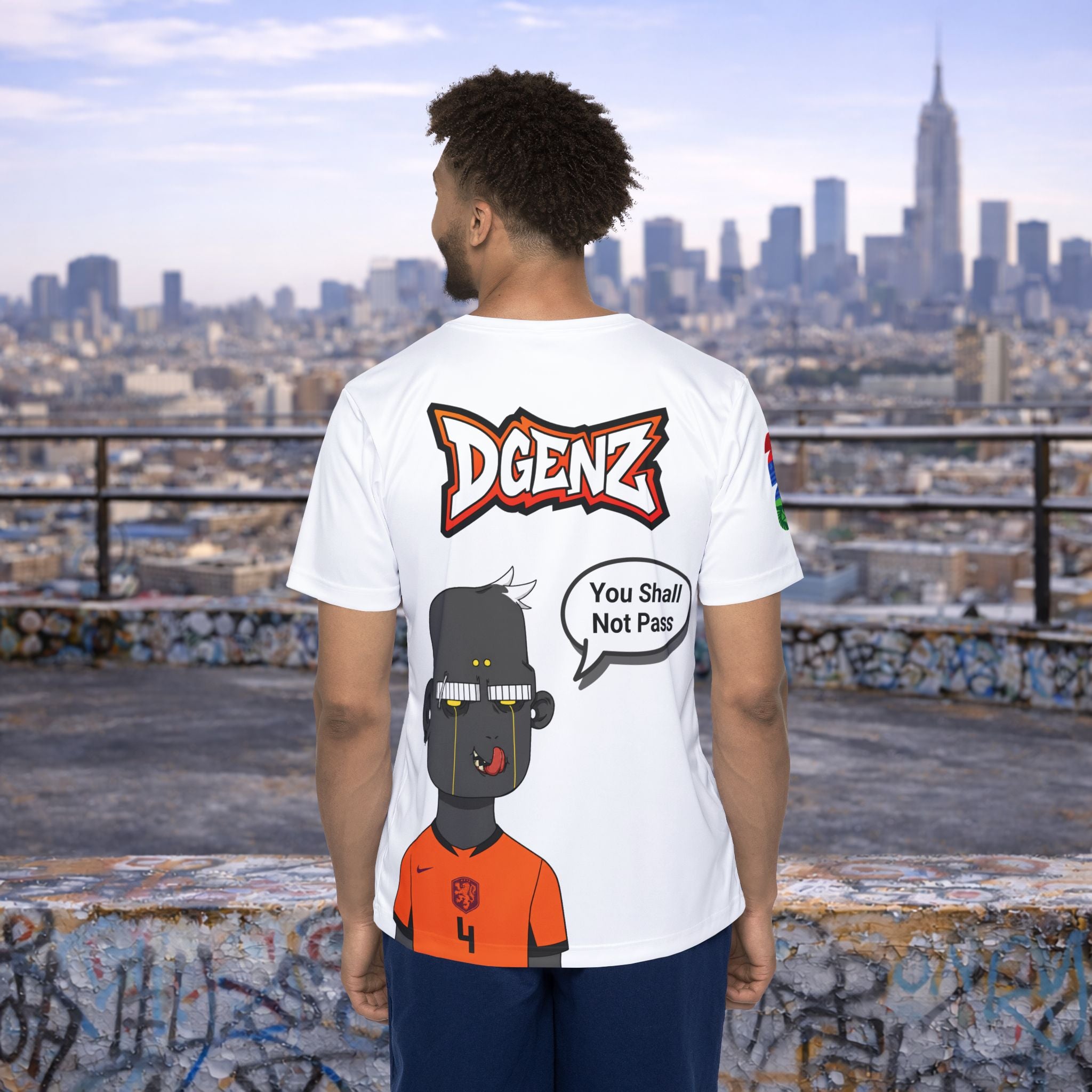 Male model wearing FIFA x DGENZ Netherlands #4 Virgil van Dijk jersey back view showing DGENZ logo, custom speech bubble and character artwork
