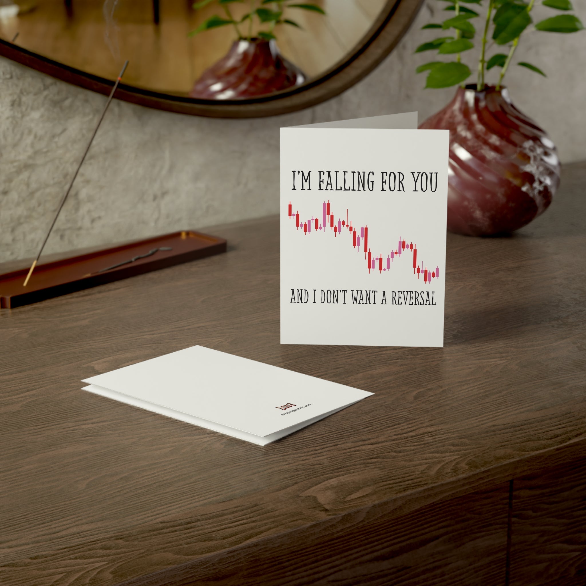 Crypto Valentine’s Day card with trading chart design displayed on a desk