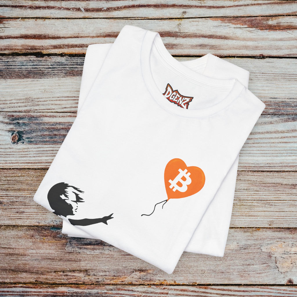 Folded white Bitcoin Banksy T-Shirt with orange BTC balloon artwork